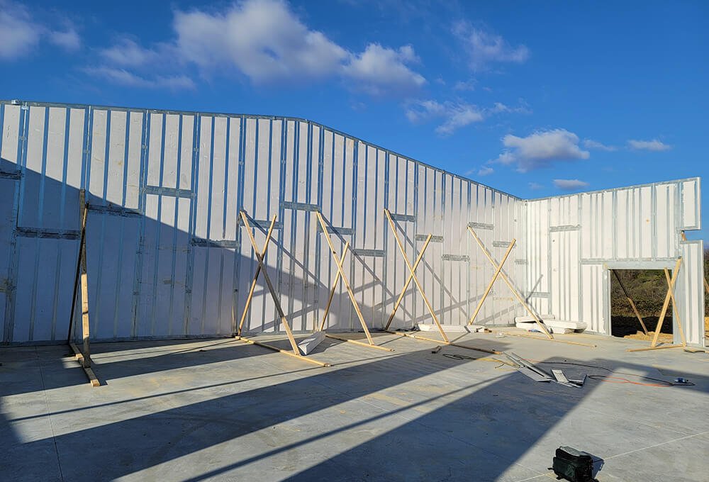 Braced ThermaSteel walls standing on a commercial slab
